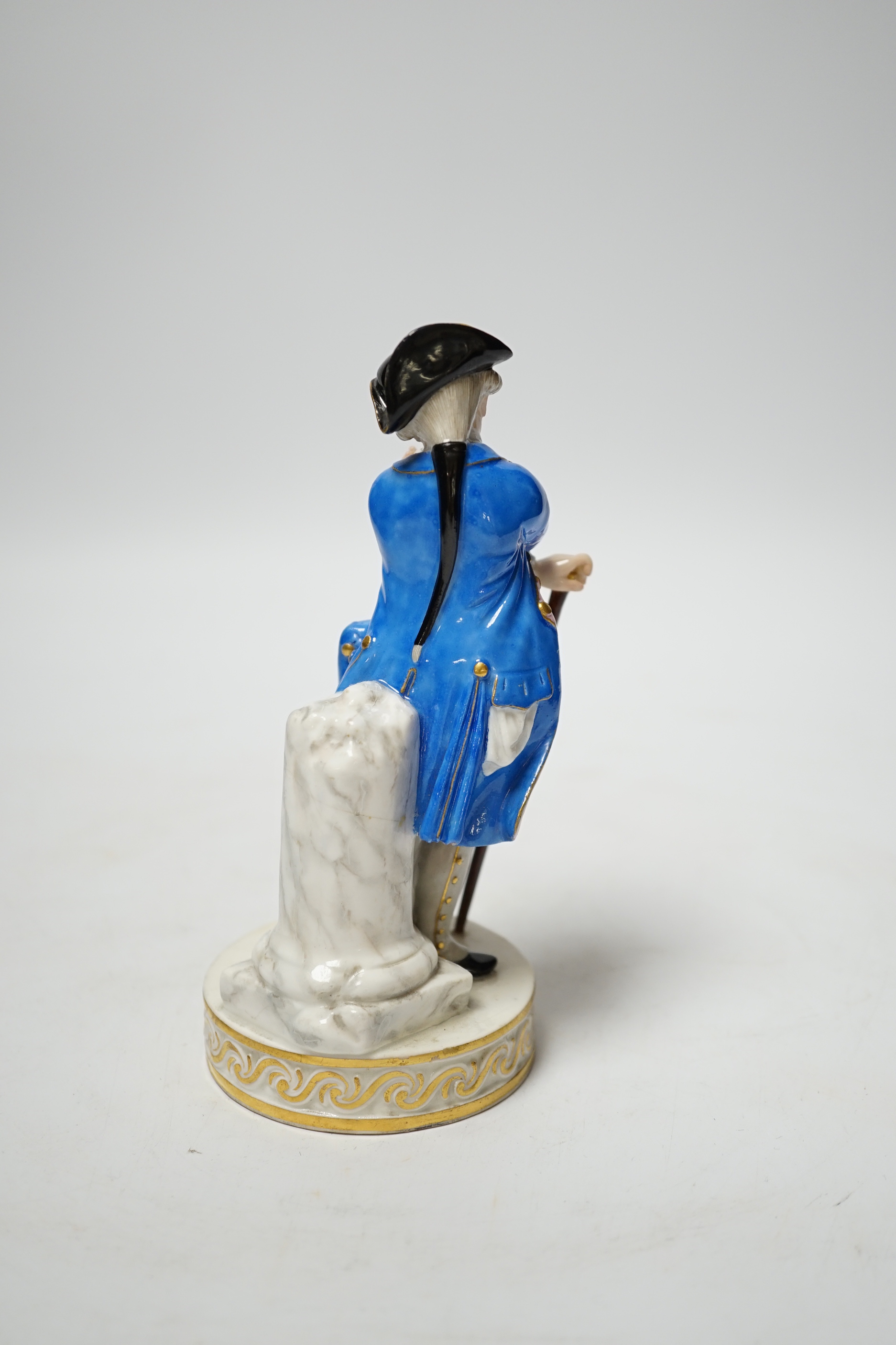 A late 19th century Meissen figure of an officer looking at his watch, incised F64 and impressed 122, 15cm